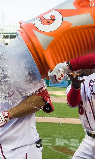 Phils lose for 1st time, Robinson forces in game-ending run